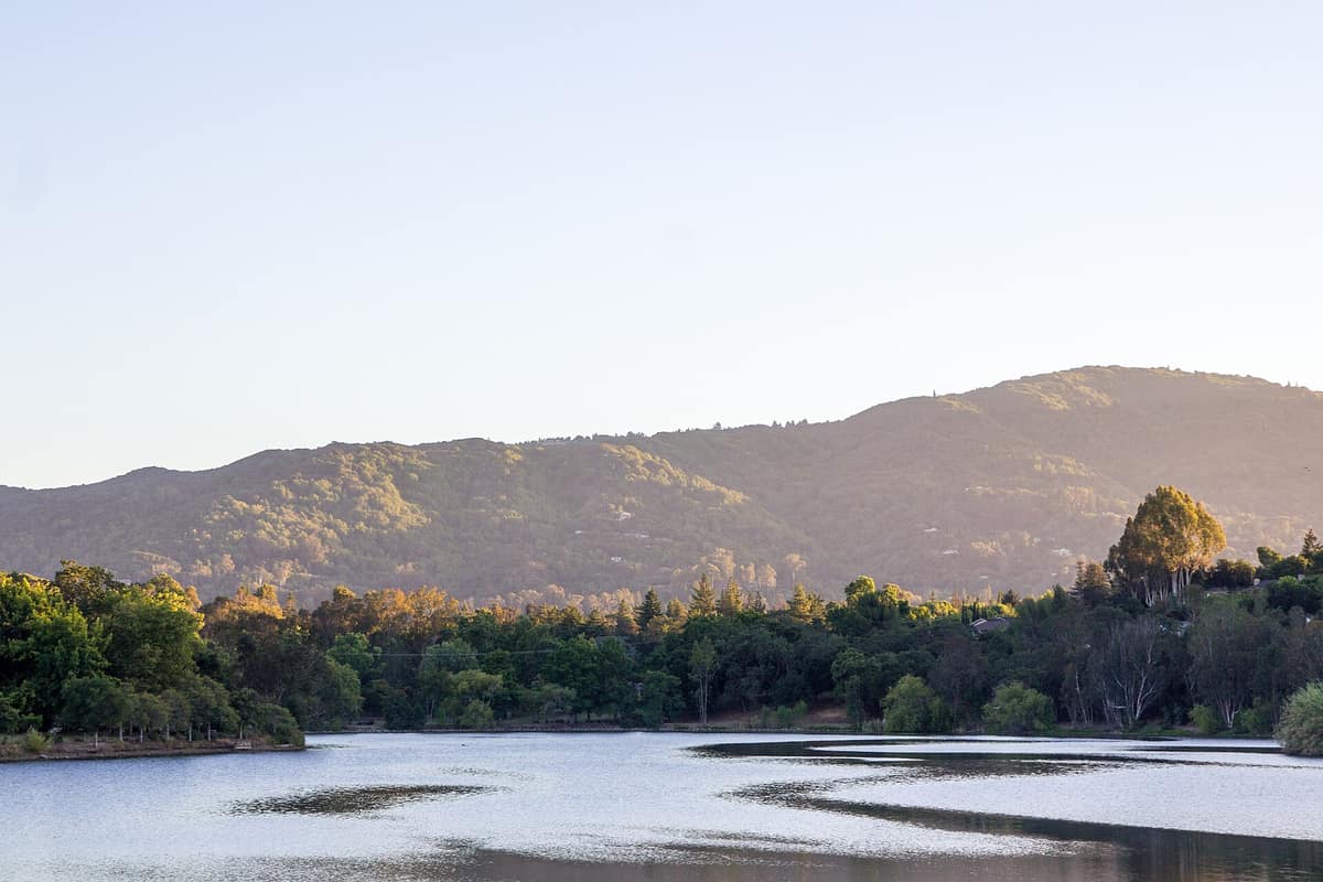 Vasona Reservoir at dusk with the foothills beyond