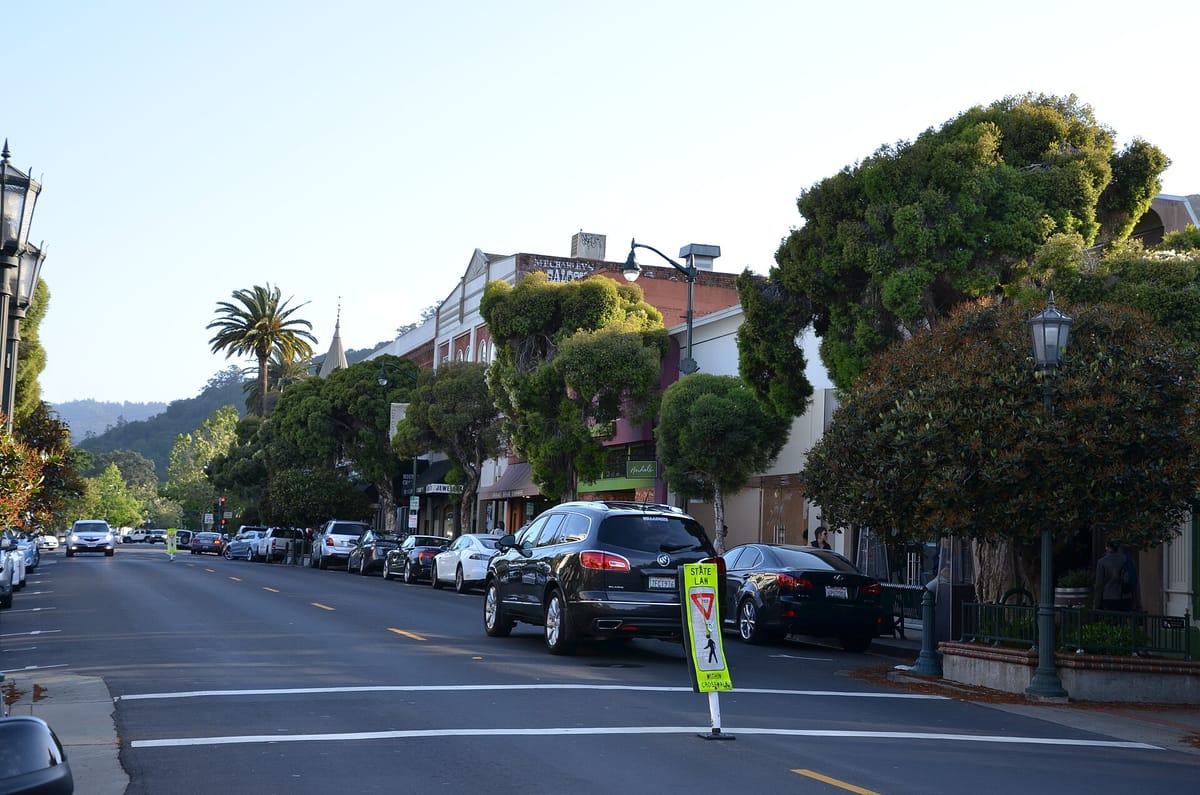 North Santa Cruz Avenue under shade trees, with the foothills beyond