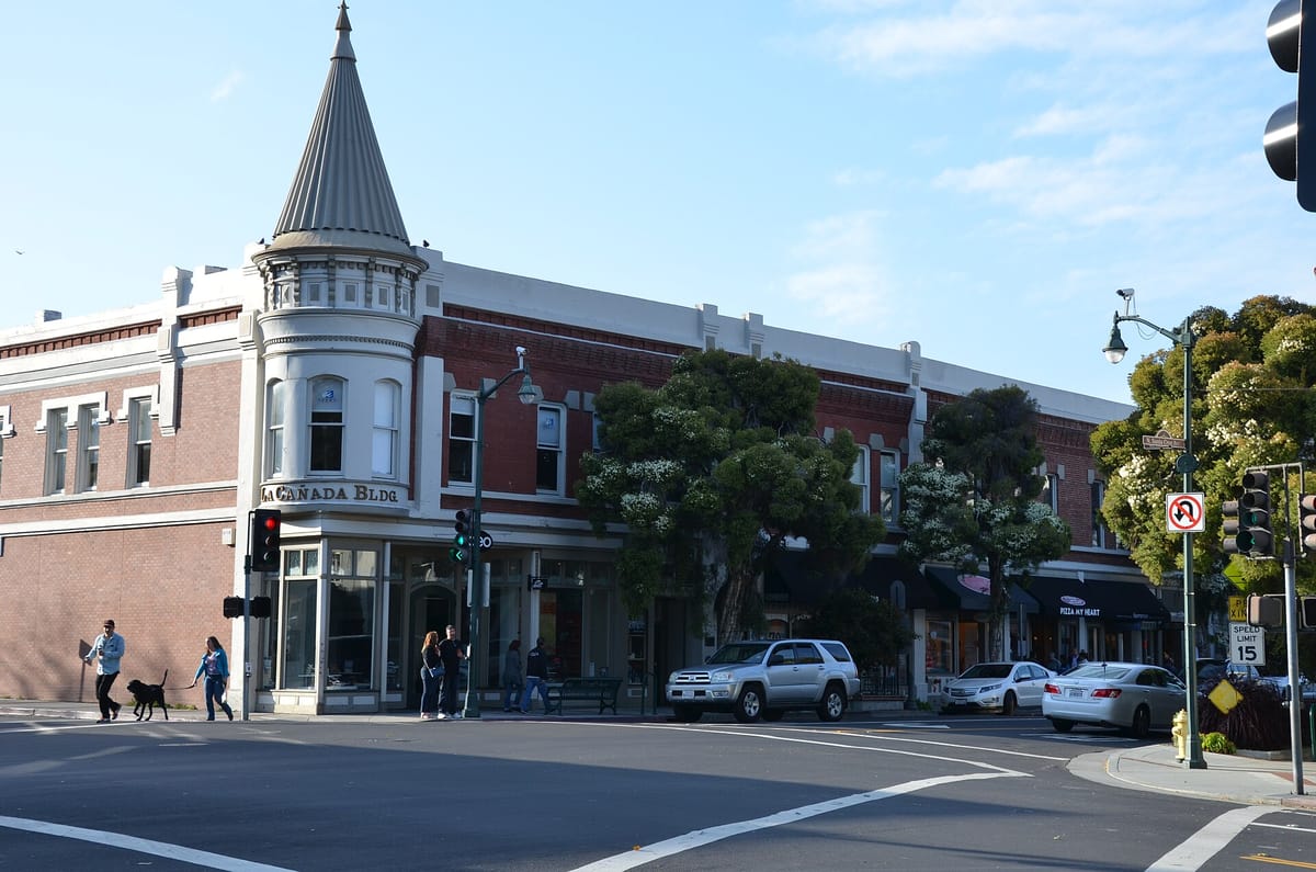 The brick La Cañada Building with its witch-hat corner turret