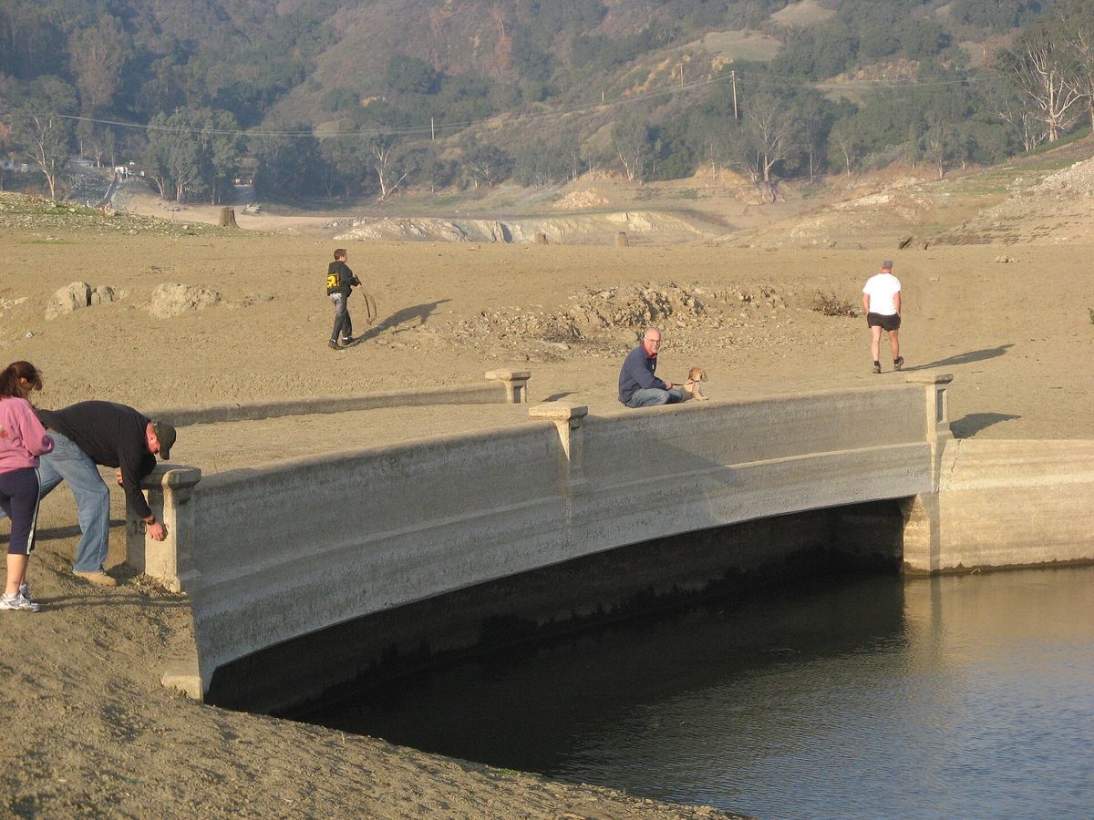 Visitors at an old bridge uncovered when Lexington Reservoir was drained in 2008