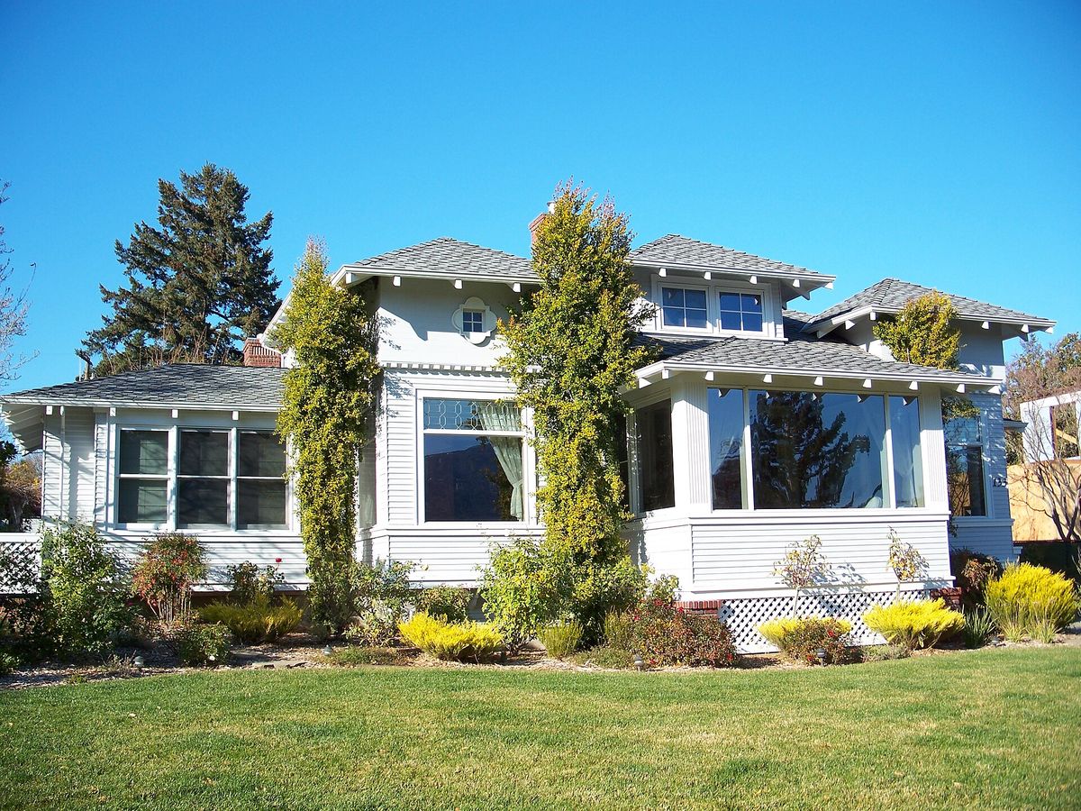 A white bungalow with a sunroom on Glen Ridge Avenue